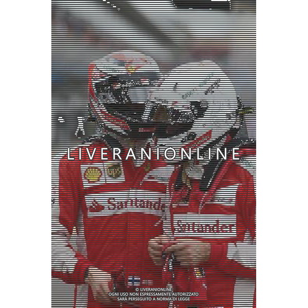 Sebastian Vettel (GER) Ferrari SF15-T and Kimi Raikkonen (FIN) Ferrari. 14.03.2015. Formula 1 World Championship, Rd 1, Australian Grand Prix, Albert Park, Melbourne, Australia, Qualifying Day. AG ALDO LIVERANI SAS ONLY ITALY