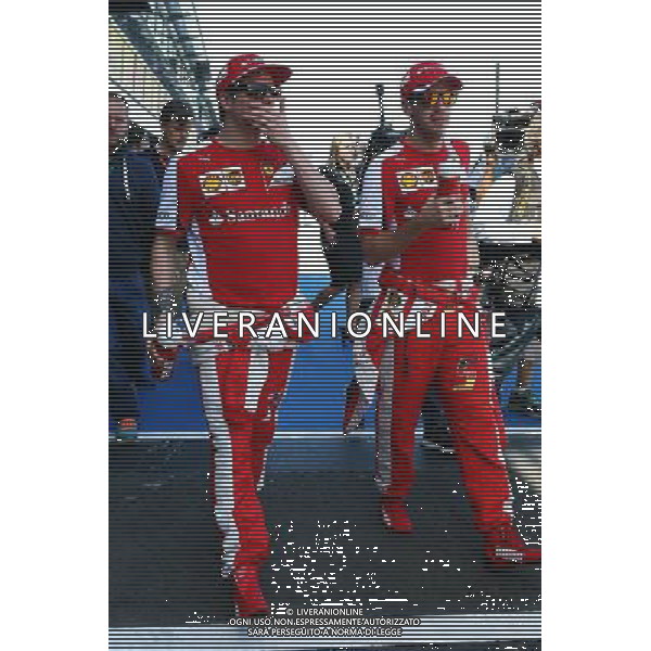 (L to R): Kimi Raikkonen (FIN) Ferrari with Sebastian Vettel (GER) Ferrari. 15.03.2015. Formula 1 World Championship, Rd 1, Australian Grand Prix, Albert Park, Melbourne, Australia, Race Day. AG ALDO LIVERANI SAS ONLY ITALY