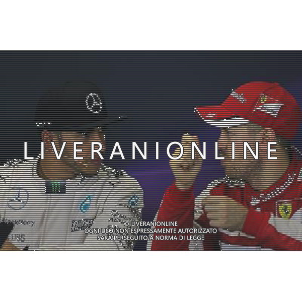 (L to R): Lewis Hamilton (GBR) Mercedes AMG F1 and Sebastian Vettel (GER) Ferrari on the podium. 15.03.2015. Formula 1 World Championship, Rd 1, Australian Grand Prix, Albert Park, Melbourne, Australia, Race Day. AG ALDO LIVERANI SAS ONLY ITALY