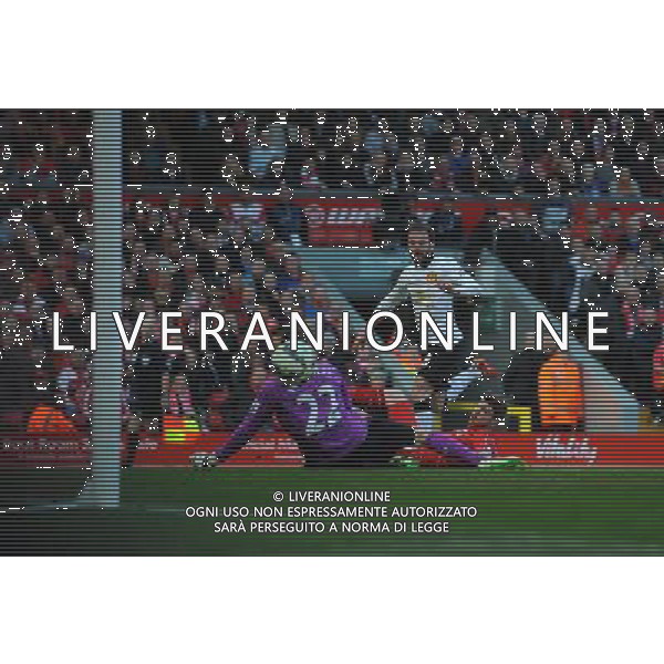 Manchester United\'s Juan Mata beats Liverpool\'s Alberto Moreno watches the ball go past Liverpool\'s goalkeeper Simon Mignolet for the opening goal of the match Photographer Kevin Barnes/CameraSport Football - Barclays Premiership - Liverpool v Manchester United - Sunday 22nd March - Anfield - Liverpool © CameraSport - 43 Linden Ave. Countesthorpe. Leicester. England. LE8 5PG - Tel: +44 (0) 116 277 4147 - admin@camerasport.com - www.camerasport.com /Agenzia Aldo Liverani sas - ITALY ONLY - EDITORIAL USE ONLY