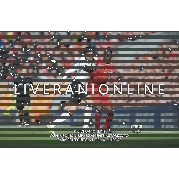 Liverpool\'s Mario Balotelli battles with Manchester United\'s Chris Smalling Photographer Kevin Barnes/CameraSport Football - Barclays Premiership - Liverpool v Manchester United - Sunday 22nd March - Anfield - Liverpool å© CameraSport - 43 Linden Ave. Countesthorpe. Leicester. England. LE8 5PG - Tel: +44 (0) 116 277 4147 - admin@camerasport.com - www.camerasport.com /AGENZIA ALDO LIVERANI SAS - ITALY ONLY - EDITORIAL USE ONLY