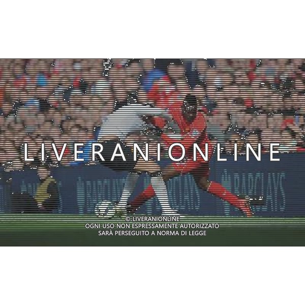 Liverpool\'s Mario Balotelli and Manchester United\'s Chris Smalling Photographer Kevin Barnes/CameraSport Football - Barclays Premiership - Liverpool v Manchester United - Sunday 22nd March - Anfield - Liverpool å© CameraSport - 43 Linden Ave. Countesthorpe. Leicester. England. LE8 5PG - Tel: +44 (0) 116 277 4147 - admin@camerasport.com - www.camerasport.com /AGENZIA ALDO LIVERANI SAS - ITALY ONLY - EDITORIAL USE ONLY