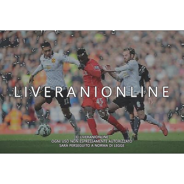 Liverpool\'s Mario Balotelli battles with Manchester United\'s Chris Smalling and Juan Mata Photographer Kevin Barnes/CameraSport Football - Barclays Premiership - Liverpool v Manchester United - Sunday 22nd March - Anfield - Liverpool å© CameraSport - 43 Linden Ave. Countesthorpe. Leicester. England. LE8 5PG - Tel: +44 (0) 116 277 4147 - admin@camerasport.com - www.camerasport.com /AGENZIA ALDO LIVERANI SAS - ITALY ONLY - EDITORIAL USE ONLY