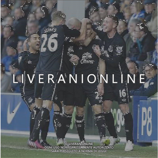 Everton players celebrate their first goal, scored by Seamus Coleman (obscured) Photographer Craig Mercer/CameraSport Football - Barclays Premiership - Queens Park Rangers v Everton - Sunday 22nd March - Loftus Road - London © CameraSport - 43 Linden Ave. Countesthorpe. Leicester. England. LE8 5PG - Tel: +44 (0) 116 277 4147 - admin@camerasport.com - www.camerasport.com AG ALDO LIVERANI SAS ONLY ITALY
