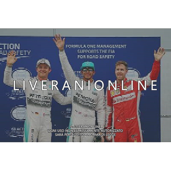 Qualifying top three in parc ferme (L to R): Nico Rosberg (GER) Mercedes AMG F1, third; Lewis Hamilton (GBR) Mercedes AMG F1, pole position; Sebastian Vettel (GER) Ferrari, second. 28.03.2015. Formula 1 World Championship, Rd 2, Malaysian Grand Prix, Sepang, Malaysia, Saturday. - www.xpbimages.com, EMail: requests@xpbimages.com - copy of publication required for printed pictures. Every used picture is fee-liable. Â© Copyright: Batchelor / XPB Images/ONLY ITALY/Agenzia Aldo Liverani s.a.s.
