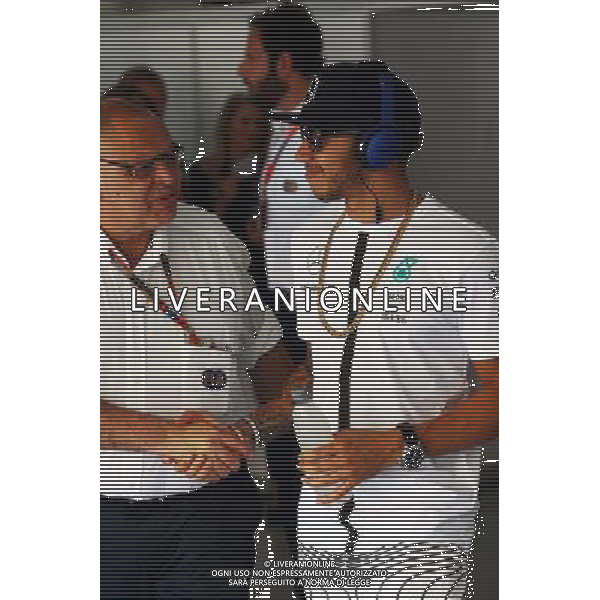 Lewis Hamilton (GBR) Mercedes AMG F1 with Pat Behar (FRA) FIA on the drivers parade. 29.03.2015. Formula 1 World Championship, Rd 2, Malaysian Grand Prix, Sepang, Malaysia, Sunday. /AGENZIA ALDO LIVERANI SAS - ITALY ONLY - EDITORIAL USE ONLY - GP F1 MALESIA GARA 29 MARZO 2015