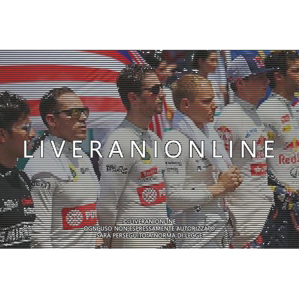 Pastor Maldonado (VEN) Lotus F1 Team and Romain Grosjean (FRA) Lotus F1 Team as the grid observes the national anthem. 29.03.2015. Formula 1 World Championship, Rd 2, Malaysian Grand Prix, Sepang, Malaysia, Sunday. /AGENZIA ALDO LIVERANI SAS - ITALY ONLY - EDITORIAL USE ONLY - GP F1 MALESIA GARA 29 MARZO 2015