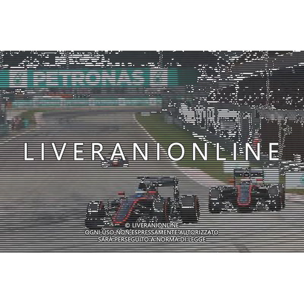 Fernando Alonso (ESP) McLaren MP4-30 leads team mate Jenson Button (GBR) McLaren MP4-30. 29.03.2015. Formula 1 World Championship, Rd 2, Malaysian Grand Prix, Sepang, Malaysia, Sunday. /AGENZIA ALDO LIVERANI SAS - ITALY ONLY - EDITORIAL USE ONLY - GP F1 MALESIA GARA 29 MARZO 2015