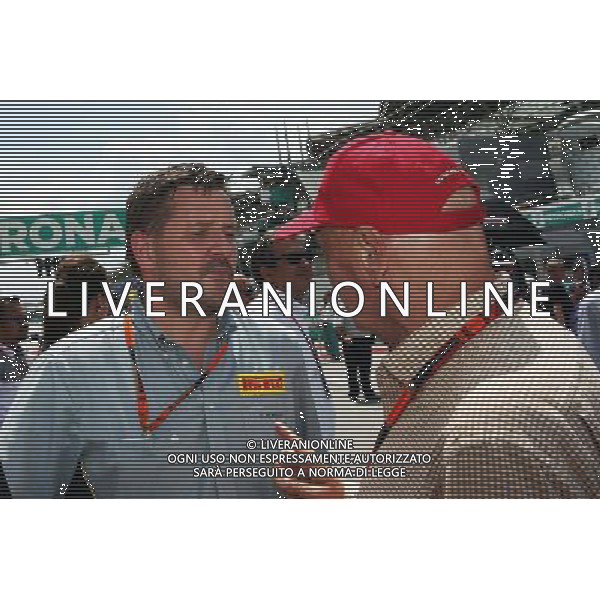 (L to R): Paul Hembery (GBR) Pirelli Motorsport Director with Niki Lauda (AUT) Mercedes Non-Executive Chairman on the grid. 29.03.2015. Formula 1 World Championship, Rd 2, Malaysian Grand Prix, Sepang, Malaysia, Sunday. /AGENZIA ALDO LIVERANI SAS - ITALY ONLY - EDITORIAL USE ONLY - GP F1 MALESIA GARA 29 MARZO 2015