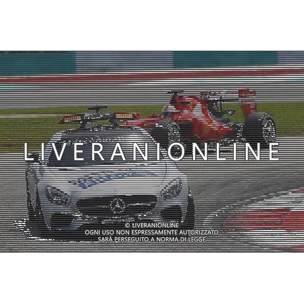 Sebastian Vettel (GER) Ferrari SF15-T leads behind the FIA Safety Car. 29.03.2015. Formula 1 World Championship, Rd 2, Malaysian Grand Prix, Sepang, Malaysia, Sunday. /AGENZIA ALDO LIVERANI SAS - ITALY ONLY - EDITORIAL USE ONLY