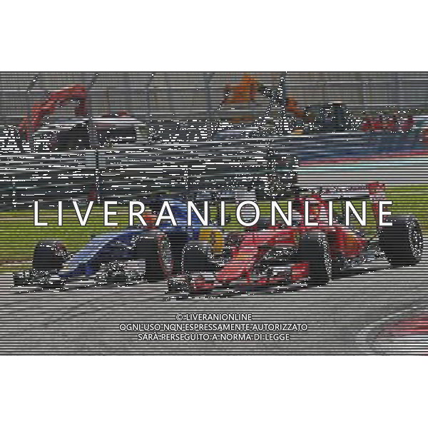 Felipe Nasr (BRA) Sauber C34 and Sebastian Vettel (GER) Ferrari SF15-T. 29.03.2015. Formula 1 World Championship, Rd 2, Malaysian Grand Prix, Sepang, Malaysia, Sunday. /AGENZIA ALDO LIVERANI SAS - ITALY ONLY - EDITORIAL USE ONLY