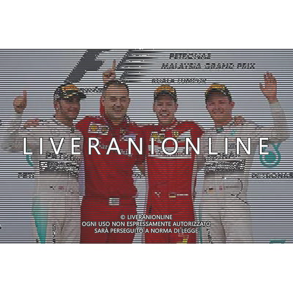 The podium (L to R): Lewis Hamilton (GBR) Mercedes AMG F1, second; Diego Ioverno (ITA) Ferrari Operations Director; Sebastian Vettel (GER) Ferrari, race winner; Nico Rosberg (GER) Mercedes AMG F1, third. 29.03.2015. Formula 1 World Championship, Rd 2, Malaysian Grand Prix, Sepang, Malaysia, Sunday. /AGENZIA ALDO LIVERANI SAS - ITALY ONLY - EDITORIAL USE ONLY