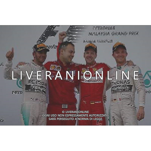 1st place Sebastian Vettel (GER) Ferrari 2nd place Lewis Hamilton (GBR) Mercedes AMG F1 and 3rd place Nico Rosberg (GER) Mercedes AMG F1 W06. 29.03.2015. Formula 1 World Championship, Rd 2, Malaysian Grand Prix, Sepang, Malaysia, Sunday. /AGENZIA ALDO LIVERANI SAS - ITALY ONLY - EDITORIAL USE ONLY