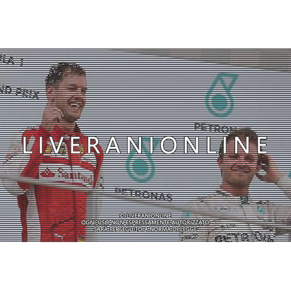 Sebastian Vettel (GER), Scuderia Ferrari and Nico Rosberg (GER), Mercedes AMG F1 Team 29.03.2015. Formula 1 World Championship, Rd 2, Malaysian Grand Prix, Sepang, Malaysia, Sunday. /AGENZIA ALDO LIVERANI SAS - ITALY ONLY - EDITORIAL USE ONLY