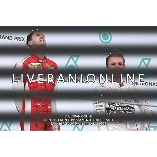 Sebastian Vettel (GER), Scuderia Ferrari and Nico Rosberg (GER), Mercedes AMG F1 Team 29.03.2015. Formula 1 World Championship, Rd 2, Malaysian Grand Prix, Sepang, Malaysia, Sunday. /AGENZIA ALDO LIVERANI SAS - ITALY ONLY - EDITORIAL USE ONLY