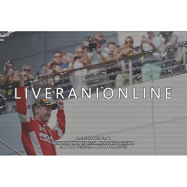 Race winner Sebastian Vettel (GER) Ferrari celebrates on the podium. 29.03.2015. Formula 1 World Championship, Rd 2, Malaysian Grand Prix, Sepang, Malaysia, Sunday. - www.xpbimages.com, EMail: requests@xpbimages.com - copy of publication required for printed pictures. Every used picture is fee-liable. © Copyright: Price / XPB Images ONLY ITALY-EDITORIAL USE ONLY-Agenzia Aldo Liverani s.a.s.