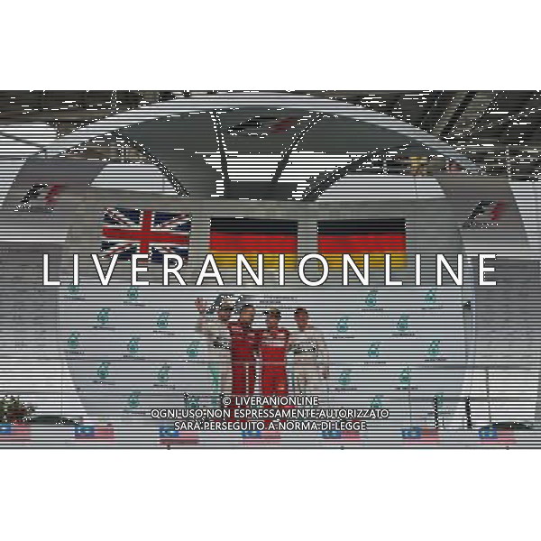 The podium (L to R): Lewis Hamilton (GBR) Mercedes AMG F1, second; Diego Ioverno (ITA) Ferrari Operations Director; Sebastian Vettel (GER) Ferrari, race winner; Nico Rosberg (GER) Mercedes AMG F1, third. 29.03.2015. Formula 1 World Championship, Rd 2, Malaysian Grand Prix, Sepang, Malaysia, Sunday. - www.xpbimages.com, EMail: requests@xpbimages.com - copy of publication required for printed pictures. Every used picture is fee-liable. Â© Copyright: Photo4 / XPB Images/Agenzia Aldo Liverani s.a.s.