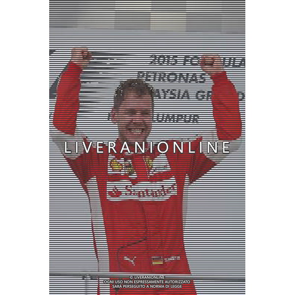 Race winner Sebastian Vettel (GER) Ferrari celebrates on the podium. 29.03.2015. Formula 1 World Championship, Rd 2, Malaysian Grand Prix, Sepang, Malaysia, Sunday. - www.xpbimages.com, EMail: requests@xpbimages.com - copy of publication required for printed pictures. Every used picture is fee-liable. Â© Copyright: Photo4 / XPB Images/Agenzia Aldo Liverani s.a.s.