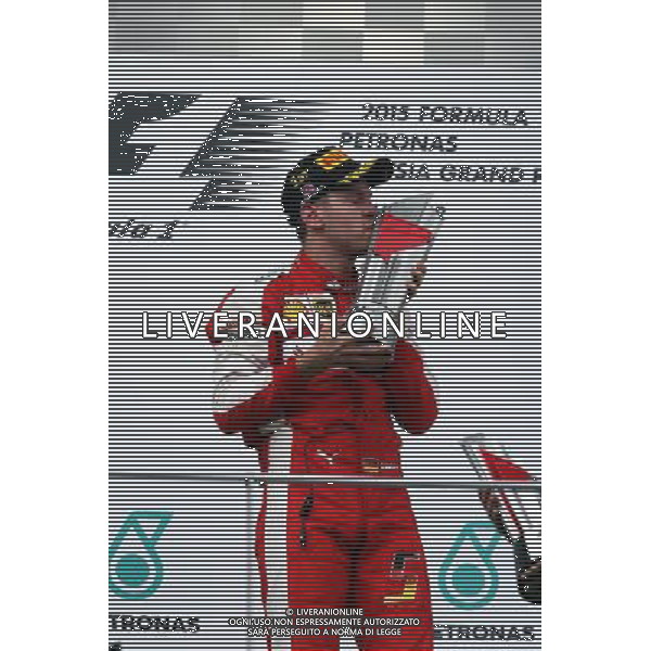 Race winner Sebastian Vettel (GER) Ferrari celebrates on the podium. 29.03.2015. Formula 1 World Championship, Rd 2, Malaysian Grand Prix, Sepang, Malaysia, Sunday. - www.xpbimages.com, EMail: requests@xpbimages.com - copy of publication required for printed pictures. Every used picture is fee-liable. Â© Copyright: Photo4 / XPB Images/Agenzia Aldo Liverani s.a.s.