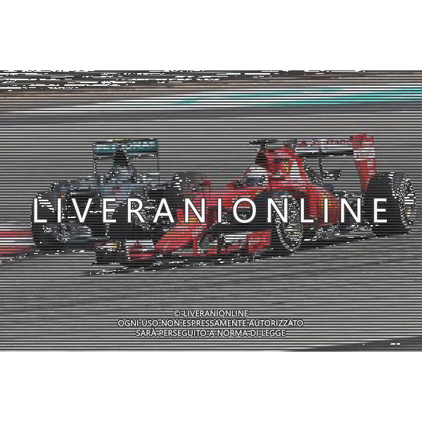 Sebastian Vettel (GER), Scuderia Ferrari and Nico Rosberg (GER), Mercedes AMG F1 Team 29.03.2015. Formula 1 World Championship, Rd 2, Malaysian Grand Prix, Sepang, Malaysia, Sunday. AG ALDO LIVERANI SAS ONLY ITALY