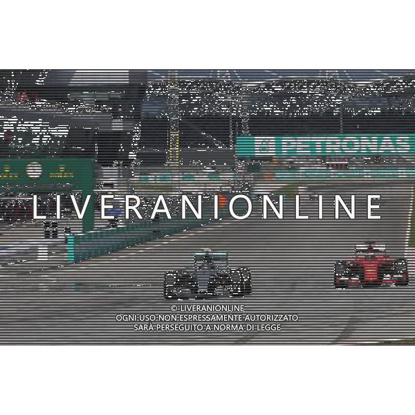 Nico Rosberg (GER), Mercedes AMG F1 Team and Kimi Raikkonen (FIN), Scuderia Ferrari 29.03.2015. Formula 1 World Championship, Rd 2, Malaysian Grand Prix, Sepang, Malaysia, Sunday. AG ALDO LIVERANI SAS ONLY ITALY