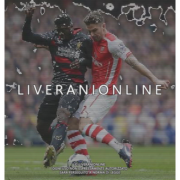 Arsenal\'s Olivier Giroud is tackled by Liverpool\'s Kolo Toure Photographer Craig Mercer/CameraSport Football - Barclays Premiership - Arsenal v Liverpool - Saturday 4th April 2015 - The Emirates Stadium - London © CameraSport - 43 Linden Ave. Countesthorpe. Leicester. England. LE8 5PG - Tel: +44 (0) 116 277 4147 - admin@camerasport.com - www.camerasport.com AG ALDO LIVERANI SAS ONLY ITALY
