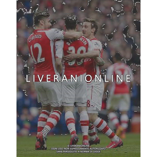 Arsenal players celebrate their opening goal, scored by Hector Bellerin (2nd from right) Photographer Craig Mercer/CameraSport Football - Barclays Premiership - Arsenal v Liverpool - Saturday 4th April 2015 - The Emirates Stadium - London © CameraSport - 43 Linden Ave. Countesthorpe. Leicester. England. LE8 5PG - Tel: +44 (0) 116 277 4147 - admin@camerasport.com - www.camerasport.com AG ALDO LIVERANI SAS ONLY ITALY