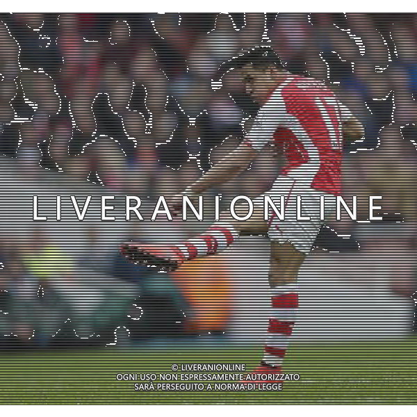 Arsenal\'s Alexis Sanchez scores his sides third goal Photographer Craig Mercer/CameraSport Football - Barclays Premiership - Arsenal v Liverpool - Saturday 4th April 2015 - The Emirates Stadium - London © CameraSport - 43 Linden Ave. Countesthorpe. Leicester. England. LE8 5PG - Tel: +44 (0) 116 277 4147 - admin@camerasport.com - www.camerasport.com AG ALDO LIVERANI SAS ONLY ITALY