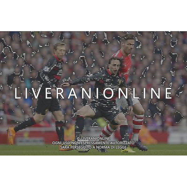 Liverpool\'s Lazar Markovic shields the ball from Arsenal\'s Olivier Giroud Photographer Craig Mercer/CameraSport Football - Barclays Premiership - Arsenal v Liverpool - Saturday 4th April 2015 - The Emirates Stadium - London © CameraSport - 43 Linden Ave. Countesthorpe. Leicester. England. LE8 5PG - Tel: +44 (0) 116 277 4147 - admin@camerasport.com - www.camerasport.com AG ALDO LIVERANI SAS ONLY ITALY