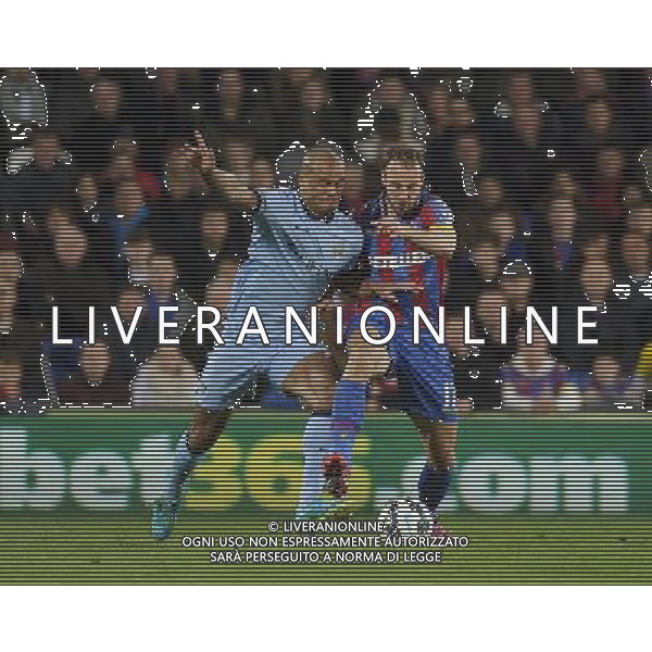 Crystal Palace\'s Glenn Murray holds off the challenge from Manchester City\'s Vincent Kompany Photographer Ashley Western/CameraSport Football - Barclays Premiership - Crystal Palace v Manchester City - Monday 6th April 2015 - Selhurst Park - London © CameraSport - 43 Linden Ave. Countesthorpe. Leicester. England. LE8 5PG - Tel: +44 (0) 116 277 4147 - admin@camerasport.com - www.camerasport.com AG ALDO LIVERANI SAS ONLY ITALY