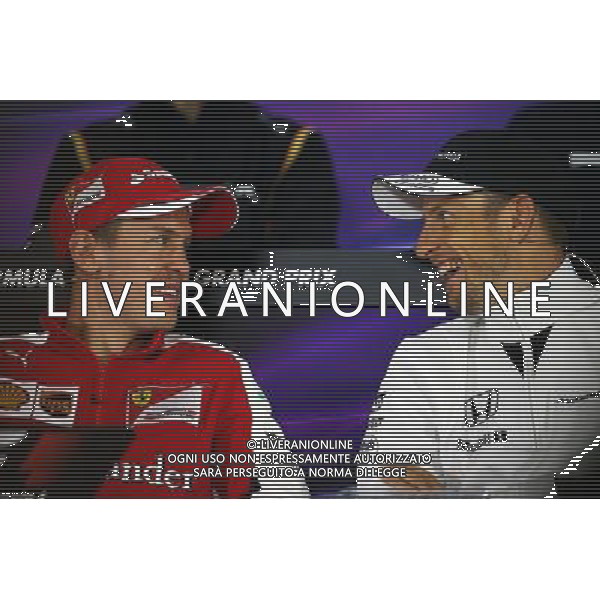 ltre Sebastian Vettel (GER) Ferrari with Jenson Button (GBR) McLaren in the FIA Press Conference. 09.04.2015. Formula 1 World Championship, Rd 3, Chinese Grand Prix, Shanghai, China, Preparation Day. /Agenzia Aldo Liverani sas - ITALY ONLY - EDITORIAL USE ONLY - GP F1 CINA
