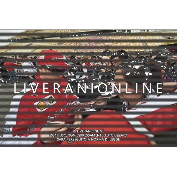 Kimi Raikkonen (FIN) Ferrari signs autographs for the fans. 09.04.2015. Formula 1 World Championship, Rd 3, Chinese Grand Prix, Shanghai, China, Preparation Day. /Agenzia Aldo Liverani sas - ITALY ONLY - EDITORIAL USE ONLY - GP F1 CINA