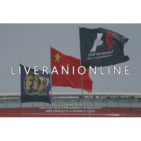F1, Chinese and FIA flags. 10.04.2015. Formula 1 World Championship, Rd 3, Chinese Grand Prix, Shanghai, China, Practice Day. AG ALDO LIVERANI SAS ONLY ITALY