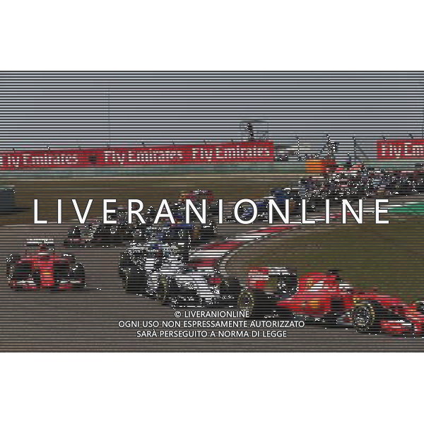 Sebastian Vettel (GER) Ferrari SF15-T leads Valtteri Bottas (FIN) Williams FW37 at the start of the race. 12.04.2015. Formula 1 World Championship, Rd 3, Chinese Grand Prix, Shanghai, China, Race Day. AG ALDO LIVERANI SAS ONLY ITALY