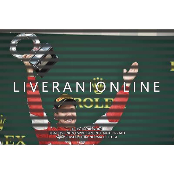 Sebastian Vettel (GER) Ferrari celebrates his third position on the podium. 12.04.2015. Formula 1 World Championship, Rd 3, Chinese Grand Prix, Shanghai, China, Race Day. AG ALDO LIVERANI SAS ONLY ITALY