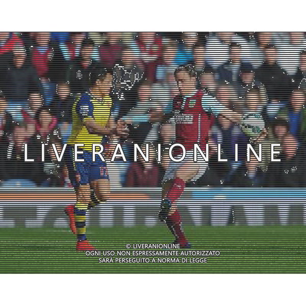 Burnley\'s Michael Duff handles the ball under pressure from Arsenal\'s Alexis Sanchez Photographer Chris Vaughan/CameraSport Football - Barclays Premiership - Burnley v Arsenal - Saturday 11th April 2015 - Turf Moor - Burnley Â¬Â© CameraSport - 43 Linden Ave. Countesthorpe. Leicester. England. LE8 5PG - Tel: +44 (0) 116 277 4147 - admin@camerasport.com - www.camerasport.com AG ALDO LIVERANI SAS ONLY ITALY
