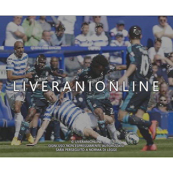 Chelsea\'s Willian is tackled by Queens Park Rangers\' Clint Hill Photographer Craig Mercer/CameraSport Football - Barclays Premiership - Queens Park Rangers v Chelsea - Sunday 12th April 2015 - Loftus Road - London Â© CameraSport - 43 Linden Ave. Countesthorpe. Leicester. England. LE8 5PG - Tel: +44 (0) 116 277 4147 - admin@camerasport.com - www.camerasport.com AG ALDO LIVERANI SAS ONLY ITALY