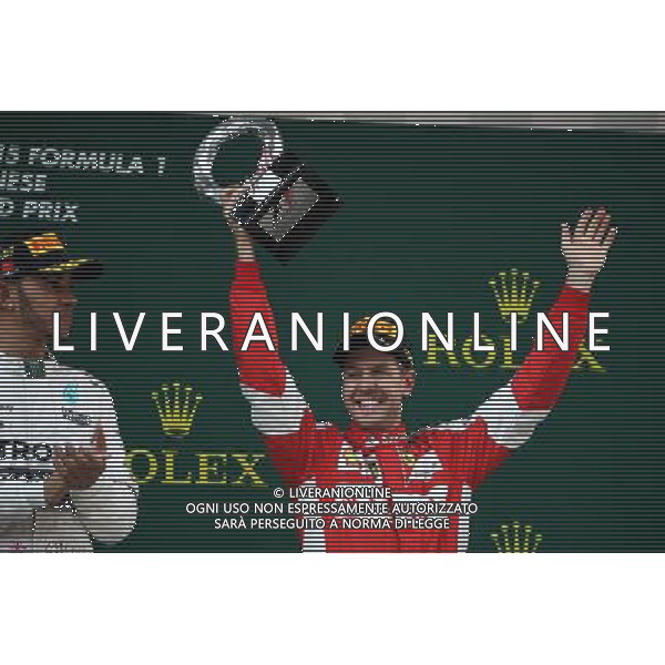 Sebastian Vettel (GER) Ferrari celebrates his third position on the podium. 12.04.2015. Formula 1 World Championship, Rd 3, Chinese Grand Prix, Shanghai, China, Race Day. AG ALDO LIVERANI SAS ONLY ITALY