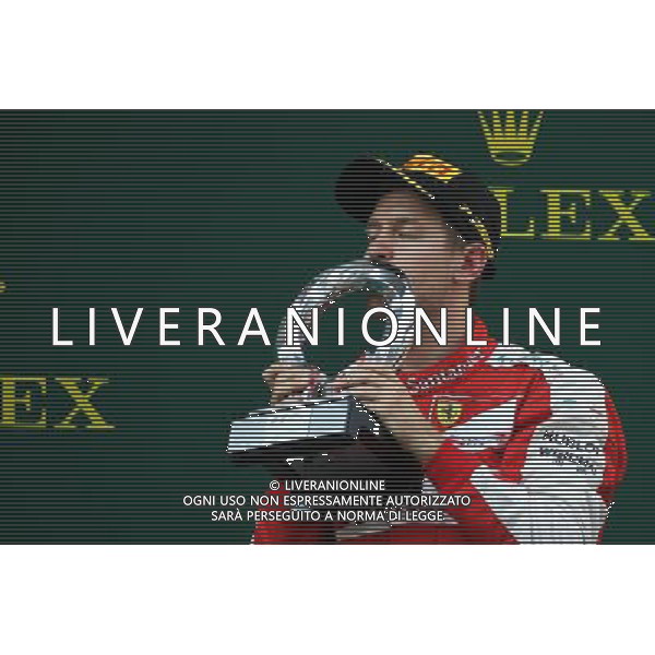 Sebastian Vettel (GER) Ferrari celebrates his third position on the podium. 12.04.2015. Formula 1 World Championship, Rd 3, Chinese Grand Prix, Shanghai, China, Race Day. AG ALDO LIVERANI SAS ONLY ITALY