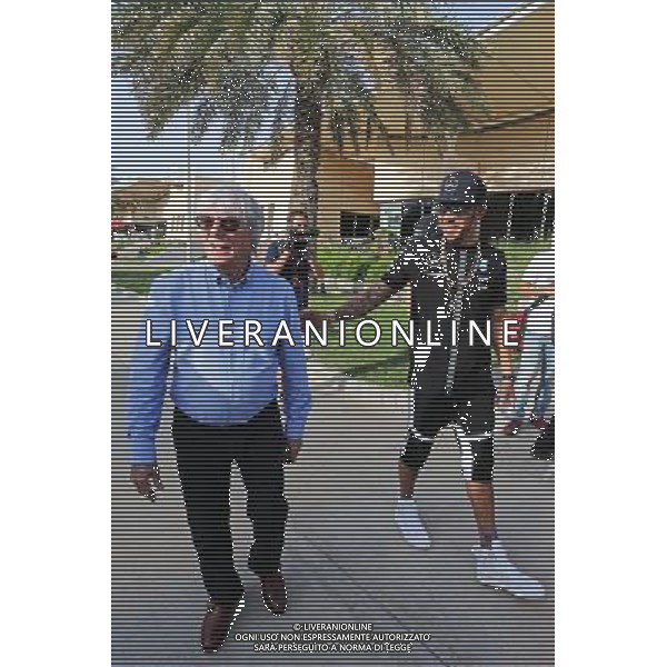 (L to R): Bernie Ecclestone (GBR) with Lewis Hamilton (GBR) Mercedes AMG F1. 16.04.2015. Formula 1 World Championship, Rd 4, Bahrain Grand Prix, Sakhir, Bahrain, Preparation Day. AG ALDO LIVERANI SAS ONLY ITALY