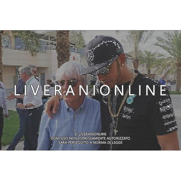 (L to R): Bernie Ecclestone (GBR) with Lewis Hamilton (GBR) Mercedes AMG F1. 16.04.2015. Formula 1 World Championship, Rd 4, Bahrain Grand Prix, Sakhir, Bahrain, Preparation Day. AG ALDO LIVERANI SAS ONLY ITALY