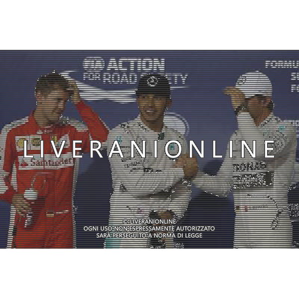 Pole for Lewis Hamilton (GBR) Mercedes AMG F1, 2nd for Sebastian Vettel (GER) Ferrari SF15-T and 3rd for Nico Rosberg (GER) Mercedes AMG F1 W06. 18.04.2015. Formula 1 World Championship, Rd 4, Bahrain Grand Prix, Sakhir, Bahrain, Qualifying Day. AG ALDO LIVERANI SAS ONLY ITALY