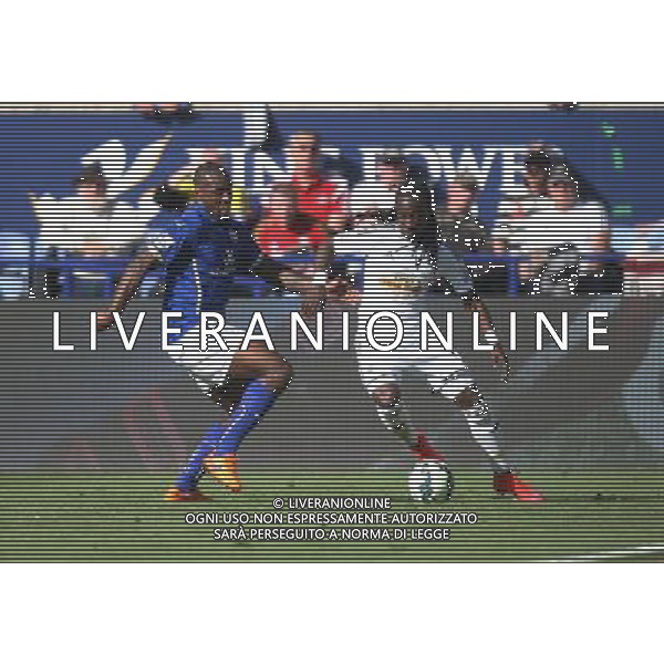 Leicester City\'s Wes Morgan (L) and Swansea City\'s Marvin Emnes in action during todays match Photographer Jack Phillips/CameraSport Football - Barclays Premiership - Leicester City v Swansea City - Saturday 18th April 2015 - King Power Stadium - Leicester © CameraSport - 43 Linden Ave. Countesthorpe. Leicester. England. LE8 5PG - Tel: +44 (0) 116 277 4147 - admin@camerasport.com - www.camerasport.com AG ALDO LIVERANI SAS ONLY ITALY