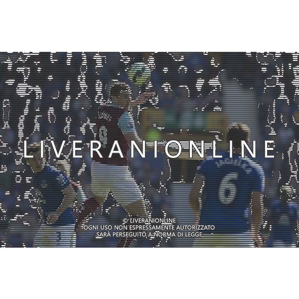 Burnley\'s Sam Vokes jumps to head the ball between Everton\'s Leighton Baines and Phil Jagielka Photographer Stephen White/CameraSport Football - Barclays Premiership - Everton v Burnley - Saturday 18th April 2015 - Goodison Park - Everton © CameraSport - 43 Linden Ave. Countesthorpe. Leicester. England. LE8 5PG - Tel: +44 (0) 116 277 4147 - admin@camerasport.com - www.camerasport.com AG ALDO LIVERANI SAS ONLY ITALY