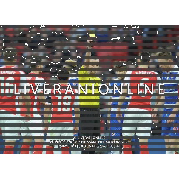 Referee Martin Atkinson shows the yellow card to Arsenal\'s Gabriel Photographer Ian Cook/CameraSport Football - The FA Cup Semi-Final - Reading v Arsenal - Saturday 18th April 2015 - Wembley - London © CameraSport - 43 Linden Ave. Countesthorpe. Leicester. England. LE8 5PG - Tel: +44 (0) 116 277 4147 - admin@camerasport.com - www.camerasport.com AG ALDO LIVERANI SAS ONLY ITALY