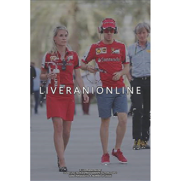 Sebastian Vettel (GER) Ferrari with Britta Roeske (AUT) Ferrari Press Officer. 19.04.2015. Formula 1 World Championship, Rd 4, Bahrain Grand Prix, Sakhir, Bahrain, Race Day. AG ALDO LIVERANI SAS ONLY ITALY