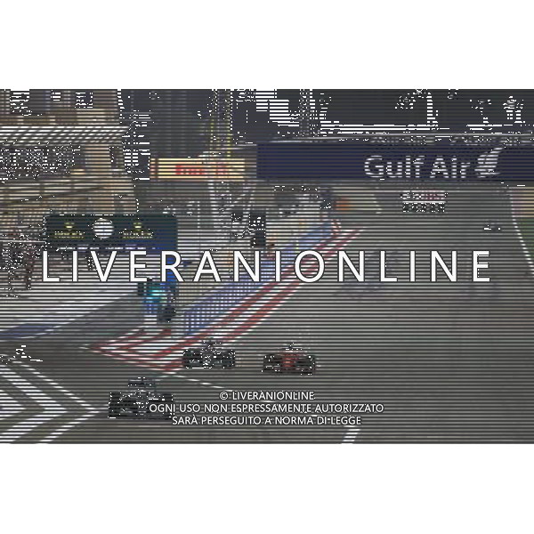 Lewis Hamilton (GBR) Mercedes AMG F1 W06 leads out of the pis as Nico Rosberg (GER) Mercedes AMG F1 W06 and Sebastian Vettel (GER) Ferrari SF15-T vfp. 19.04.2015. Formula 1 World Championship, Rd 4, Bahrain Grand Prix, Sakhir, Bahrain, Race Day. /Agenzia Aldo Liverani Sas - ITALY ONLY - EDITORIAL USE ONLY