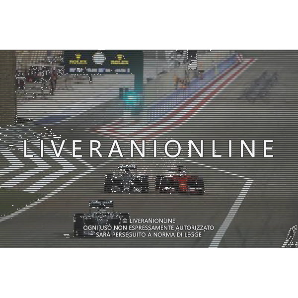 Lewis Hamilton (GBR) Mercedes AMG F1 W06 leads out of the pis as Nico Rosberg (GER) Mercedes AMG F1 W06 and Sebastian Vettel (GER) Ferrari SF15-T vfp. 19.04.2015. Formula 1 World Championship, Rd 4, Bahrain Grand Prix, Sakhir, Bahrain, Race Day. /Agenzia Aldo Liverani Sas - ITALY ONLY - EDITORIAL USE ONLY