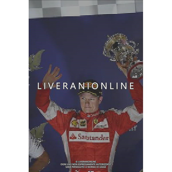 2nd place Kimi Raikkonen (FIN) Ferrari. 19.04.2015. Formula 1 World Championship, Rd 4, Bahrain Grand Prix, Sakhir, Bahrain, Race Day. /Agenzia Aldo Liverani sas - ITALY ONLY - EDITORIAL USE ONLY - GARA