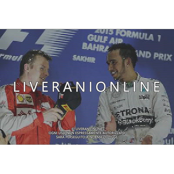The podium (L to R): second placed Kimi Raikkonen (FIN) Ferrari with race winner Lewis Hamilton (GBR) Mercedes AMG F1. 19.04.2015. Formula 1 World Championship, Rd 4, Bahrain Grand Prix, Sakhir, Bahrain, Race Day. /Agenzia Aldo Liverani sas - ITALY ONLY - EDITORIAL USE ONLY - GARA